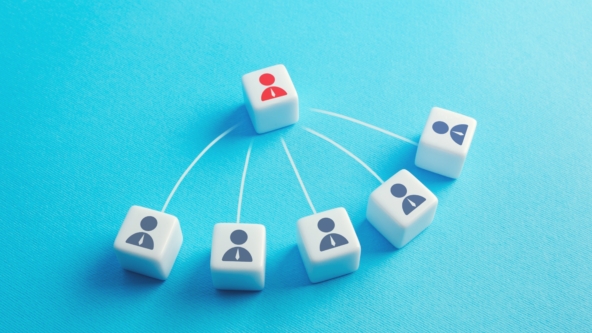 A group of dice with people icons